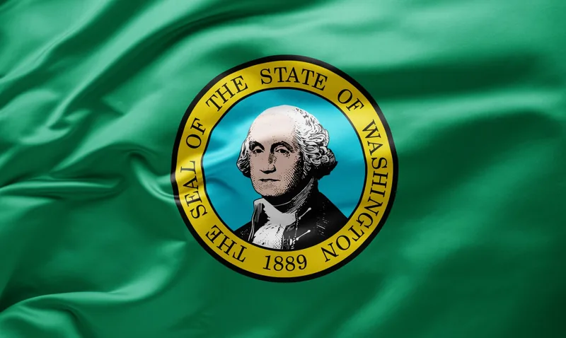 Washington state flag with the state seal and George Washington portrait on a green field
