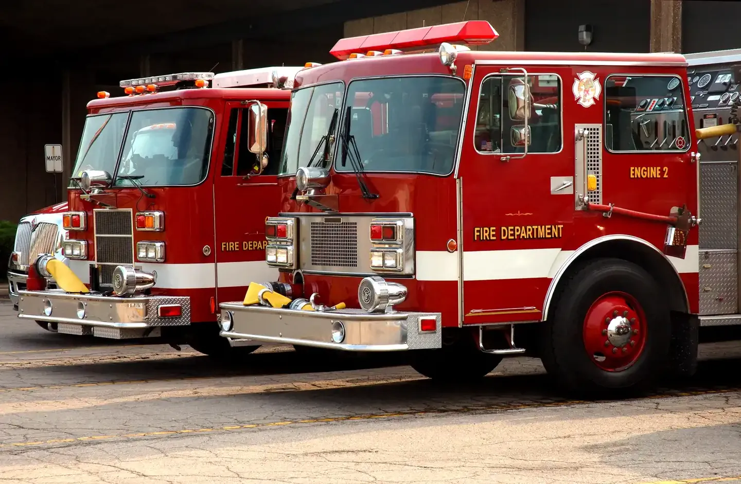 Red fire engines parked at a fire station